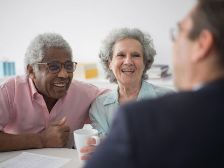 smiling older couple in meeting