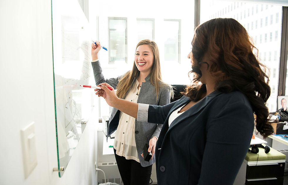 people writing on whiteboard