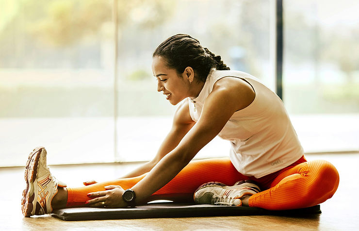 woman stretching on floor