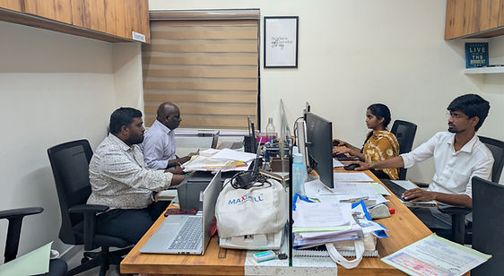 Colleagues working at computers in an office.