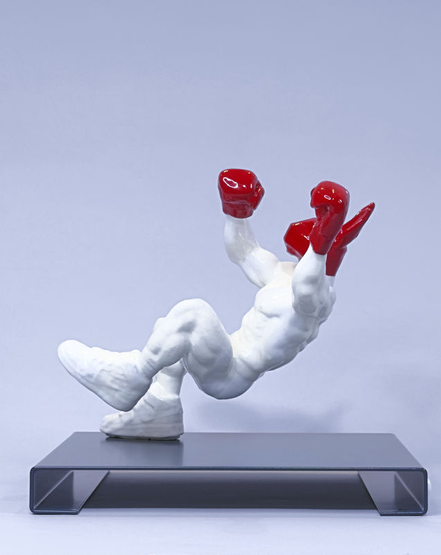 PUNCH ME BABY… by PORNOBUNNY, rear view; boxer sculpture with gloves falling backward