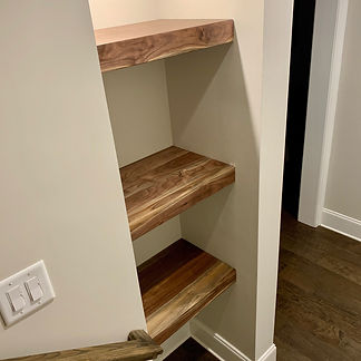 62 Screws custom Walnut floating shelves made and installed locally in Alpharetta, Georgia