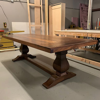 62 Screws custom Walnut trestle dining table and pedestal dining table in Alpharetta, Georgia