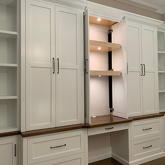 62 Screws premium hardwood office built-in with an oversized desk, custom lighting, and cabinet storage in North Atlanta