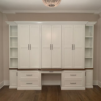 62 Screws custom luxury office built-in with oversized cabinets, hardwood modern desk, and floating shelves