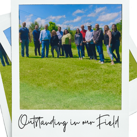 Staff "Outstanding in our Field" standing in a field