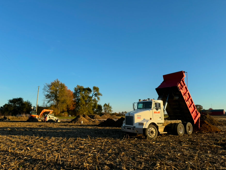 Salek excavating Dump Truck