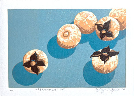 reduction linocut of american persimmons on a blue background