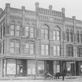 This Gothic Revival Style commercial block was completed in 1883 and is one of few buildings that survived a devastating fire in 1898. The building...