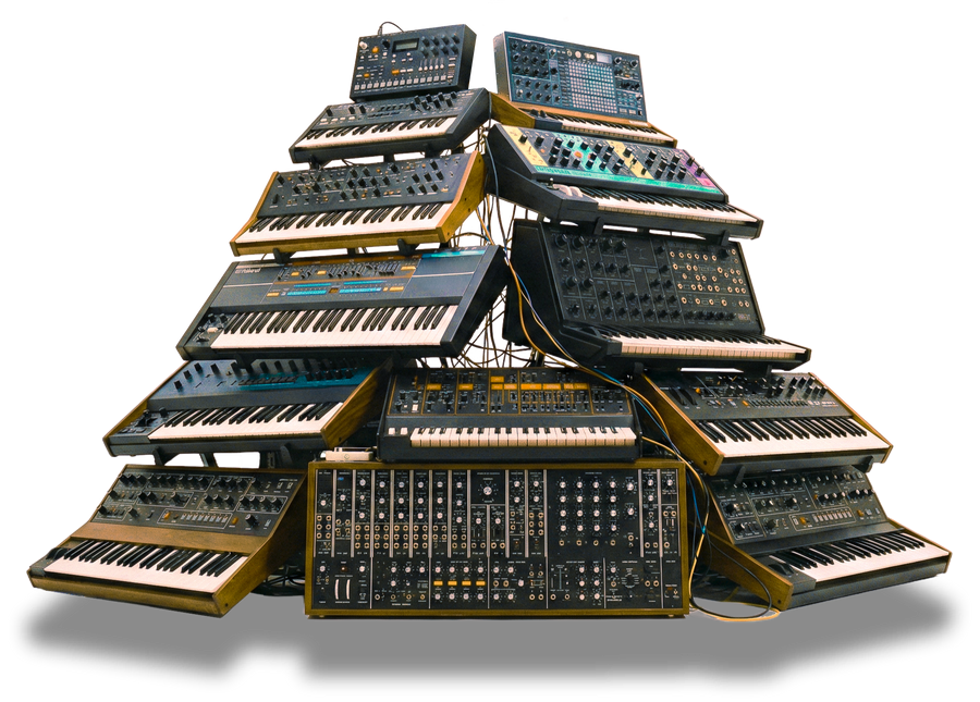 A pile of vintage and modern analog synthesizers