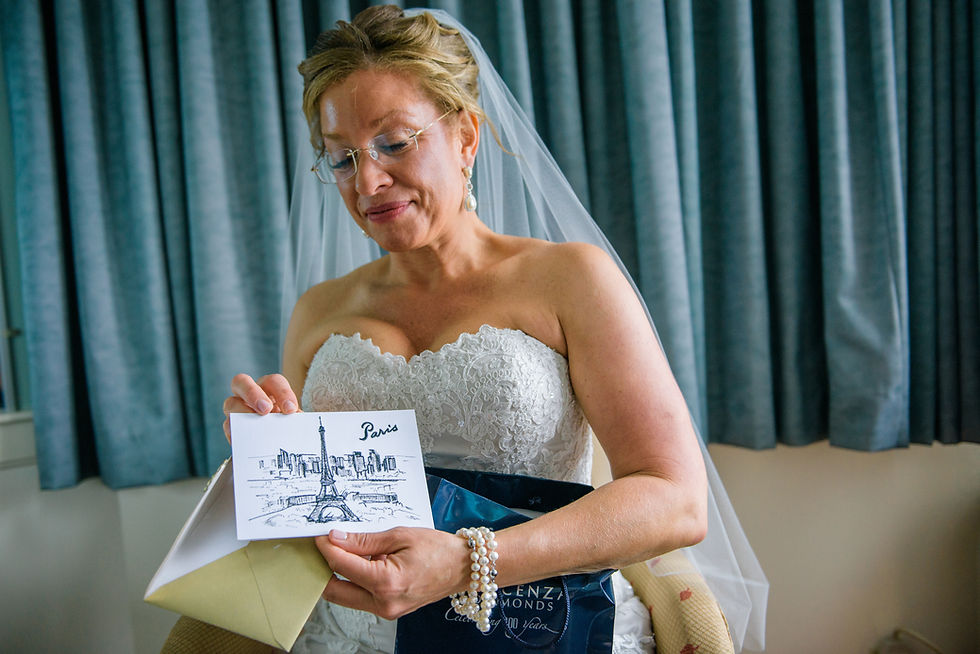 Bride opening gift from groom