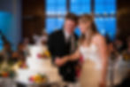 Bride and Groom cut wedding cake at the Exchange Boston