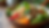Eye-level view of a vibrant salad bowl with fresh vegetables and grains