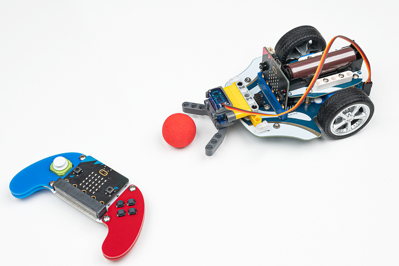 a toy car (CuteBot) with a red ball and a Microbit powered remote