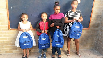 Children receiving donations at Just Care