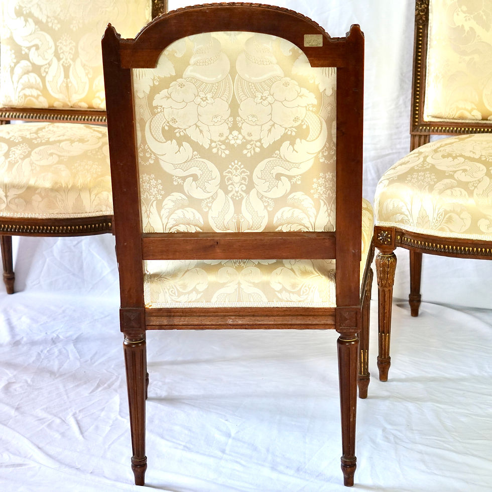 Thumbnail: Set of four Louis XVI-style French walnut and parcel gilt side chairs