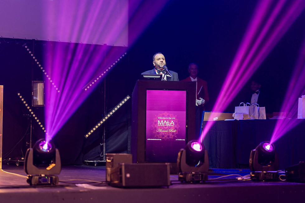 Judge Afzal on stage at the MALA Ball 2025