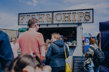 Customers queue in front of the Little Fishy trailer at a food festival