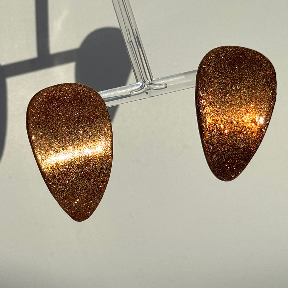 Simple Bended Glittery Drop Earrings Bijoux Vii Idea collection dark caramel color on the earring stand
