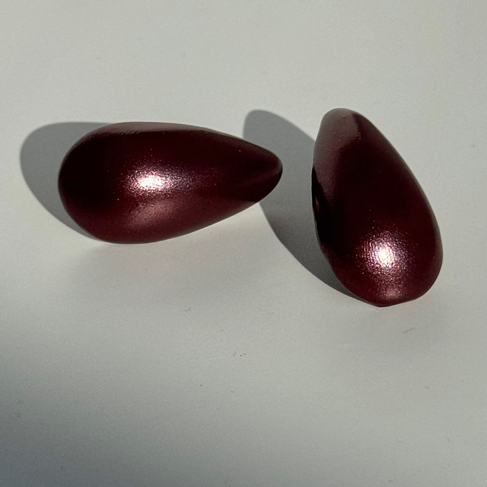 Thumbnail: Balloon Drop Metallic Earrings Bijoux Vii dark burgundy lying down on the table
