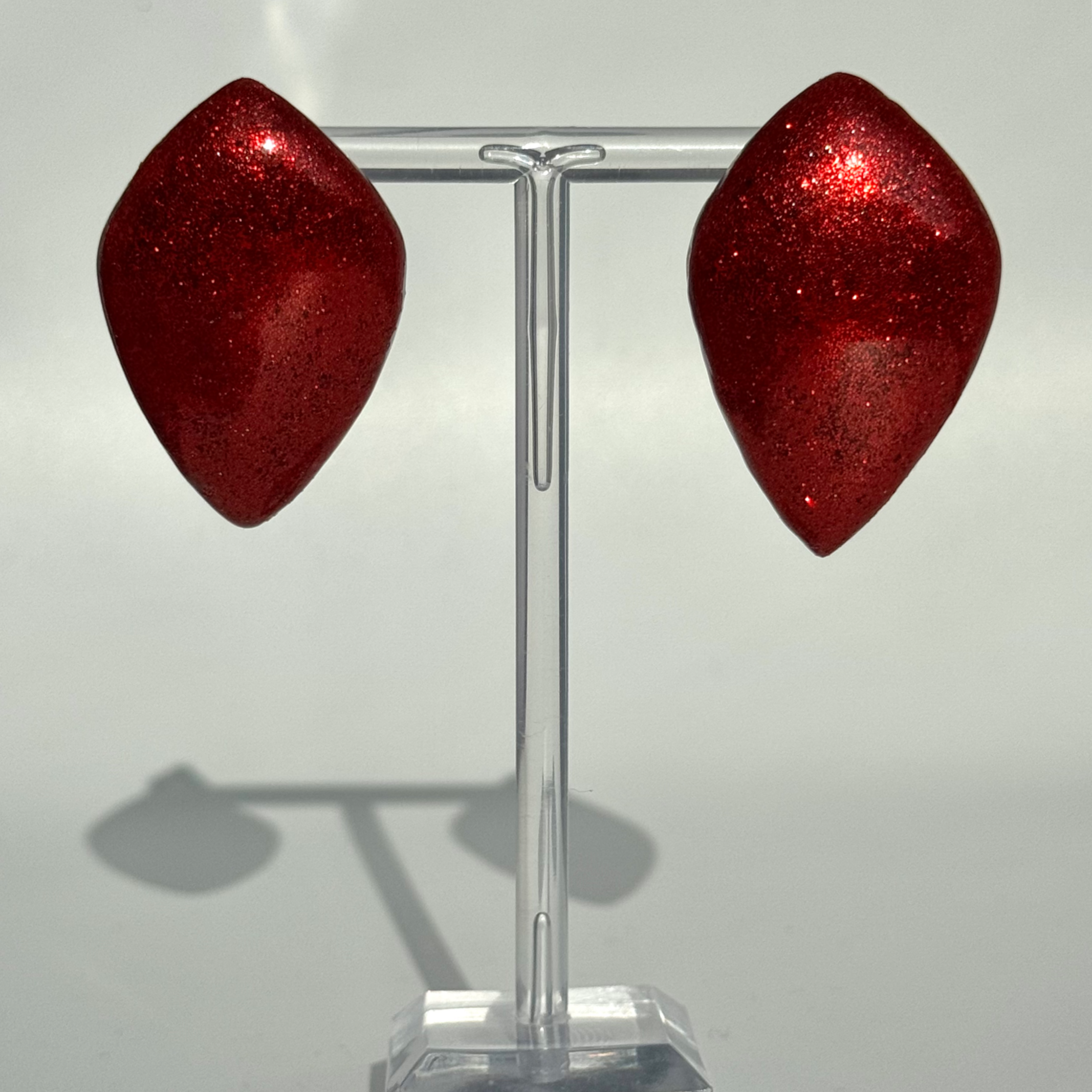 Balloon Petal Glittery Red earrings Bijoux Vii Idea Collection on the earring stand