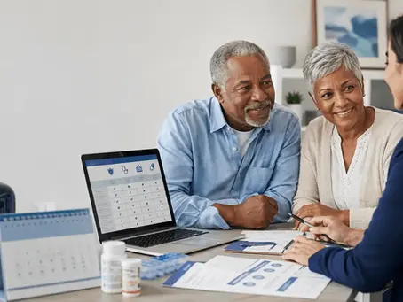 Senior couple reviewing Medicare Advantage plan options during AEP