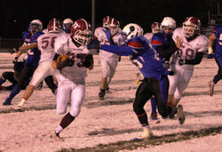Spencer Lockwood Tackled by Putnam's Cody LaScola.jpg