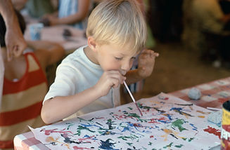 young boy painting