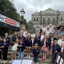 Bodmin Way Community Choir busking alongside pupils