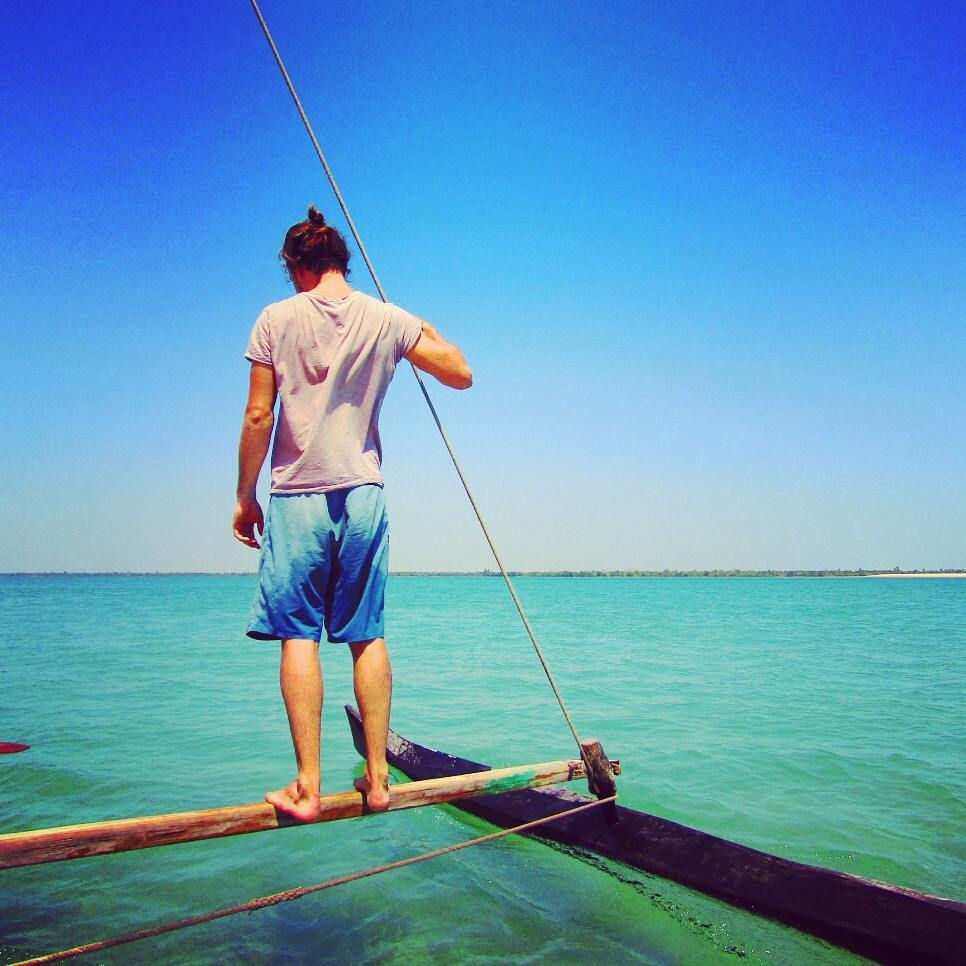 Romeo shows off his balance on the sail pirogue