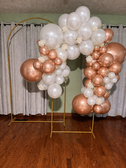 Rose gold and white balloon backdrop for special event