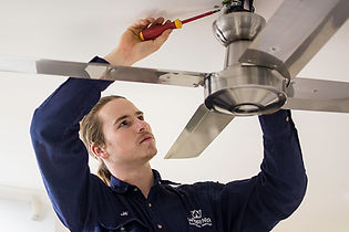Electrician installing celing fan