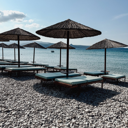 Beachbeds and umbrellas at Mykali Beach Samos