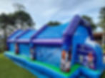 Eye-level view of inflatable soap football game setup in outdoor area