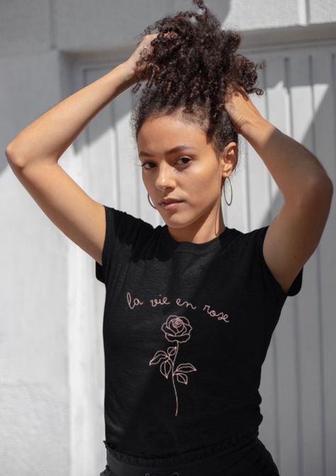 Woman wearing black la vie en rose tshirt 