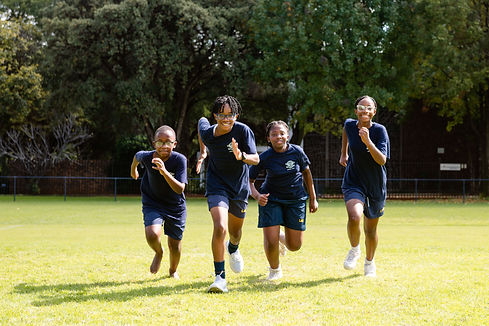 Grade 7 learners running during PT.