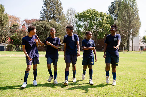 Grade 7 learners out on the field during PT.