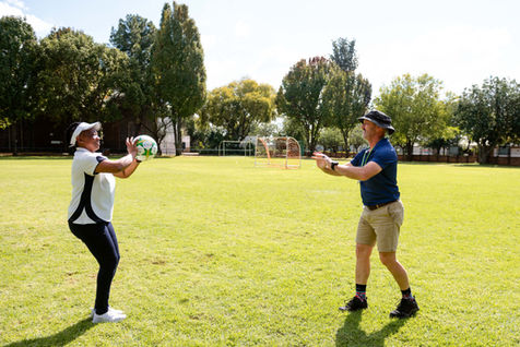An image of two PT coaches during a PT lesson.
