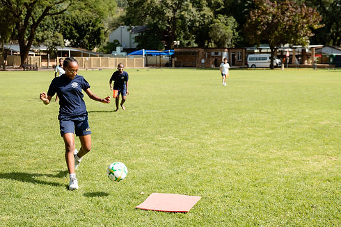 An image of a girl playing soccer during Soccer Extramurals