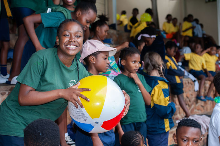 An image of a learner smiling while the the Loreto Queenswood Swimming Gala.