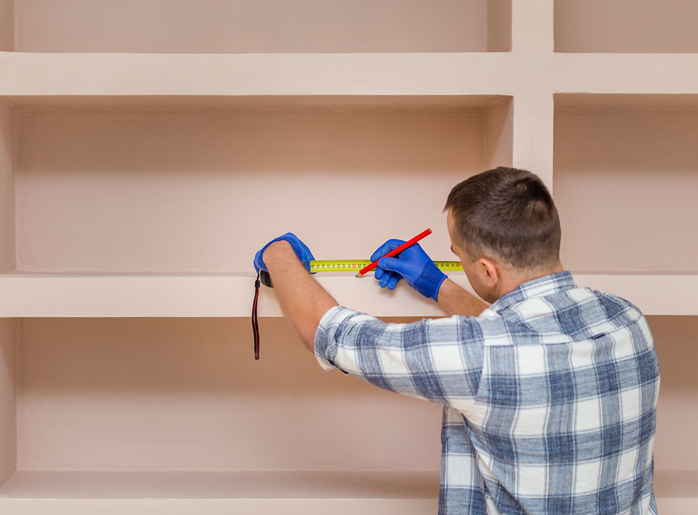 Man taking measurements with a tape measure