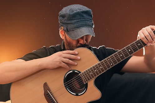 portrait-handsome-young-songwriter-with-his-guitar.jpg