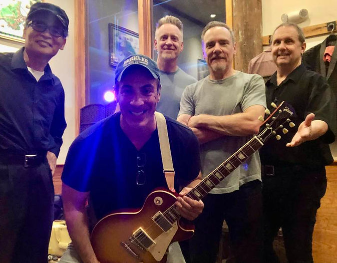 Group photo of musicians smiling