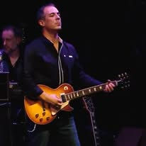 Serious guitarist focused on playing