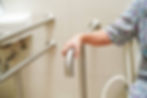Elderly woman using bathroom