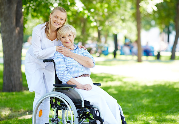senior-woman-with-her-caregiver-outdoor.jpg