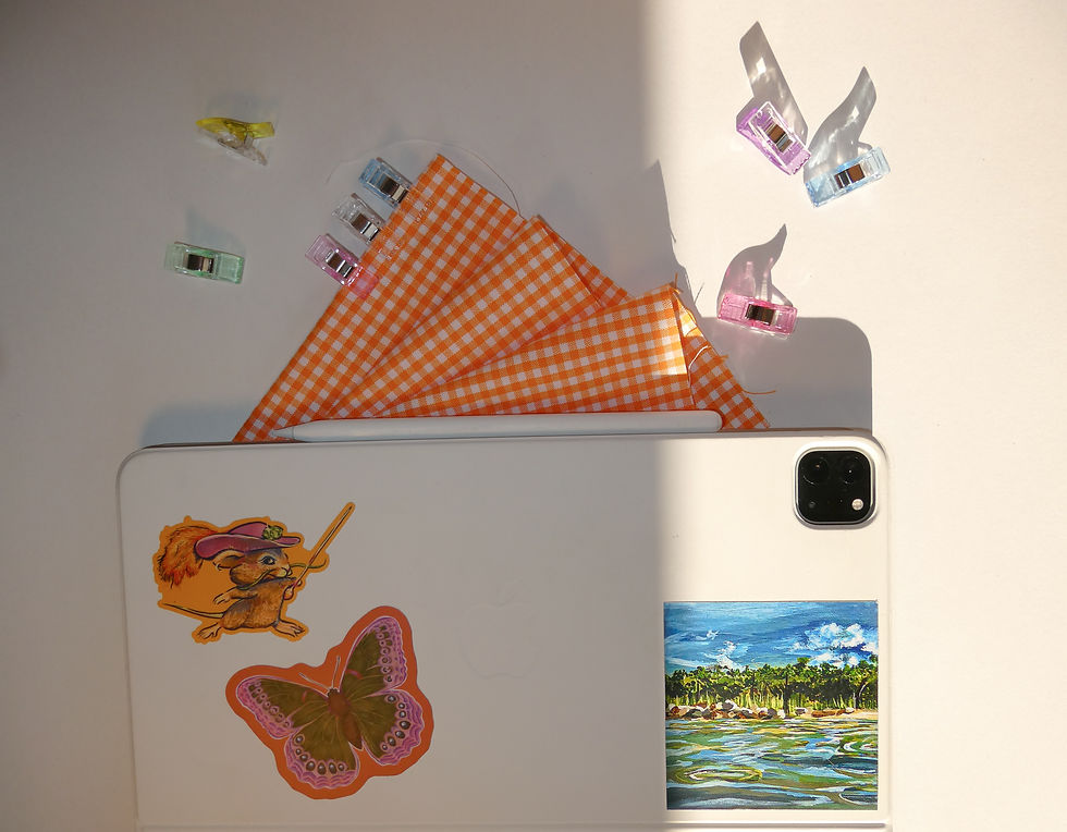 Thumbnail: Winter 2026 Collection Stickers showcased on a white tablet case orange gingham fabric showcasing the vibrancy of the sticker