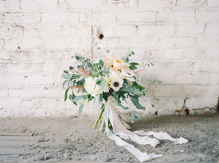 Bridal bouquet by Studio Bloom Iowa of anemone, juliet garden roses, and eucalyptus