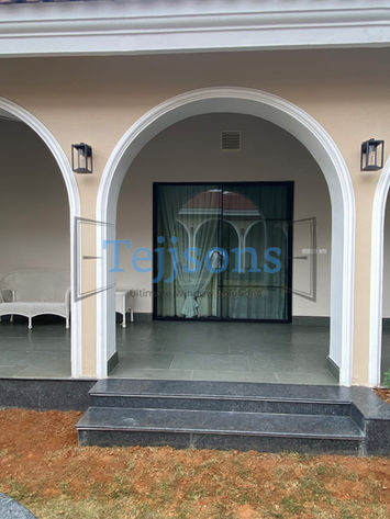 Tejsons black pleated insect screen on an arched porch