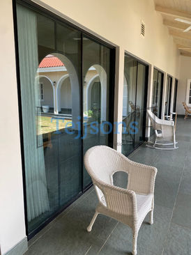 Sliding glass doors with black frames on a patio
